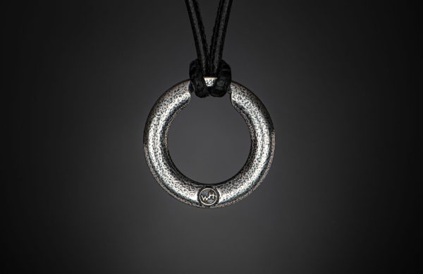 William Henry SILVER ORBIT 22" Black Leather Cord
Based on a simple premise, the Orbit is both an elegant piece of jewelry and a perfect solution to holding sunglasses or readers. This version is rendered in sterling silver with a bold rivet pattern setagainst a soft textured backdrop. Offered on a finely stitched leather cord with a sterling silver hook and eye clasp. The earliest prototype of this piece, worn by designer Matt Conable for a couple years now, gets endless comments both for form and function, and we’re happy to finally make it a part of our line. - Image 2