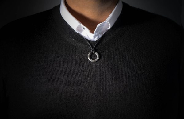 William Henry SILVER ORBIT 22" Black Leather Cord
Based on a simple premise, the Orbit is both an elegant piece of jewelry and a perfect solution to holding sunglasses or readers. This version is rendered in sterling silver with a bold rivet pattern setagainst a soft textured backdrop. Offered on a finely stitched leather cord with a sterling silver hook and eye clasp. The earliest prototype of this piece, worn by designer Matt Conable for a couple years now, gets endless comments both for form and function, and we’re happy to finally make it a part of our line. - Image 3