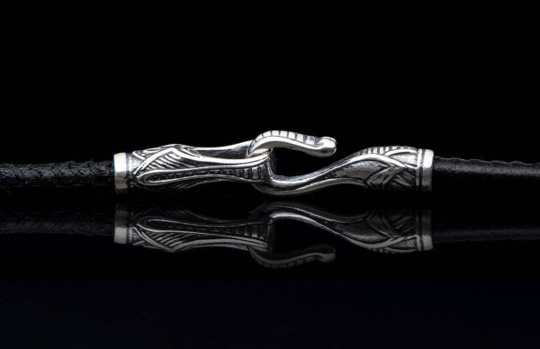 William Henry SILVER ORBIT 22" Black Leather Cord
Based on a simple premise, the Orbit is both an elegant piece of jewelry and a perfect solution to holding sunglasses or readers. This version is rendered in sterling silver with a bold rivet pattern setagainst a soft textured backdrop. Offered on a finely stitched leather cord with a sterling silver hook and eye clasp. The earliest prototype of this piece, worn by designer Matt Conable for a couple years now, gets endless comments both for form and function, and we’re happy to finally make it a part of our line. - Image 4