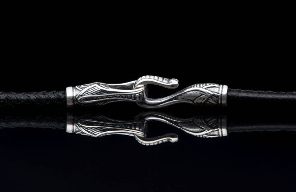 William Henry is proud of our American heritage, and we pay homage to the strength and ideals that created the dream we all share. The Denali is a striking pendant wrought in sterling silver with artwork that captures the iconography of our history. A wishbone clip in PVD black coated stainless steel holds one to three guitar picks, and whether you play guitar or you don’t, this piece is gorgeous on the neck. Finished with a fine stitched leather cord and sterling silver clasp, entirely built in our Oregon studio.