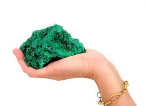 Velveteen Malachite
Our Velveteen Malachite has a striking emerald green color with beautiful CHATOYANCY. What is chatoyancy you ask (sha-toy-en-see)? Chatoyancy is a phenomenon in gemology, also known as cat’s eye effect, an optical reflectance effect seen in certain gemstones and minerals. Light reflecting off of the intricate clusters of radiating malachite crystals creates a holographic effect. This visual phenomenon can be compared to the brilliant sheen reflecting off the fibers of velvet. Hence why we call our Fibrous Malachite, “Velveteen Malachite”…it is so lustrous and silky smooth!

This rich and lustrous specimen is sourced directly from the Rusahi Mine from the Katanga Province in the Democratic Republic of Congo. Fibrous Malachite has been declining in supplies after a reassurance of materials in 2010. This mineral will surely become a collector’s item and add a special pop of color to your living space!

Malachite is known as the stone of transformation. It encourages unconditional love, change, and risk-taking. Gift this to a loved one who might be going through a difficult time.

Specimen Locality: Ruashi Mine. Katanga Province, Democractic Republic of Congo

Read more about Velveteen Malachite and how its formed from our LuxeRox Mineral Library
What’s included?

Palm-size specimen crafted by Mother Earth
LuxeRox Lucite Mineral Display stand (4” x 4”)
LuxeRox Velvet Storage Pouch (5” x 6”)
From the desk of LuxeRox: All specimens from LuxeRox are rough natural material.  Every order contains a one-of-a-kind work of art as crafted by Mother Nature.  All specimens will vary slightly in size, color, and shape.  All subscription-based specimens will fit in our signature LuxeRox velvet pouch and mineral stand. Not a single type of specimen will ever be the same.