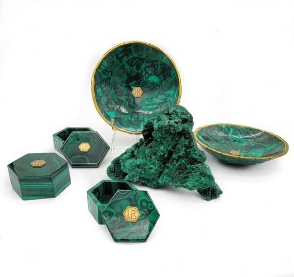 Keep your most treasured adornments in our LuxeRox Malachite Trinket Box. Each hexagon-shaped ornate container is hand-carved and assembled with precision and finished with our signature LuxeRox antique brass logo. You will admire the natural striped pattern along with its electrifying green banding throughout. Malachite is known as the stone of transformation and unconditional love.
