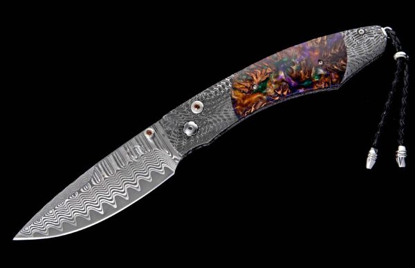 The Spearpoint 'Big Easy' features a beautiful frame in 'River Rock' damascus by Chad Nichols, inlaid with mini pine cones in resin. The blade is 'Wave' pattern damascus steel with an extra-strong core of ZDP-189. The one-hand button lock and the thumb stud are set with smoky quartz gemstones. A remarkable design that gives you an instrument with a full-size secure grip, and a versatile deep-belly blade, the Spearpoint epitomizes William Henry’s core philosophy – that superlative function deserves to be elevated to superlative art. The 'Big Easy' also features William Henry's most admired and distinctive forged metals; a timeless heirloom to be proudly worn and used for a lifetime before being handed-down to another generation
FEATURES & SPECS
One-hand button lock system

Dimensions:

Blade 3.06" (77.7mm)
Handle 4.13" (104.9.5mm)
Overall open 7.19" (182.6mm) - Image 2