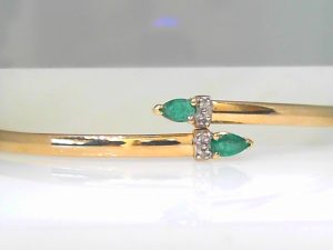 Lady's Yellow 10 Karat Bangle Bracelet Length 7 With 2= Pear Emeralds And 4= Round Diamonds