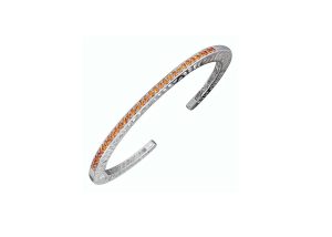 White SS Interlocking Spiral Cuff Bracelet Length 7,  33= Round Rhodolite Garnet, 1.55mm ea,

Solid, narrow (3mm) cuff bracelet; pierced with signature interlocking spirals. 
The cuff has a spring hinge for better fit.. It is designed to fit tightly onthe wrist (because with this design, you shouldn’t manually squeeze tighten the cuff). Large fits a 7-7.5” wrist.