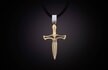 The Bandit is as clean and honest as it gets. A striking dagger, rendered in solid 18K yellow gold with a sterling silver bale, in a design so simple and timeless that it needs no embellishment. Offered on a finely stitched black leather cord with our ‘arrow’ toggle closure system. Small enough to wear layered with other pieces, bold enough to stand alone in the spotlight.
Product SKU: P53 YG

MATERIALS
18K Gold
Fine grain leather
Sterling Silver
FEATURES & SPECS
Gold pendant size: 1.4" tall x .81" wide