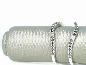 Lady's White 24 Karat Curvedl Wedding Band Size 7 With 21=0.20Tw Round Black Diamonds