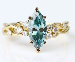 Lady's Yellow 14 Karat Aqua With Diamond Accent Fashion Ring Size 6.5 With One = 1.50Ct Marquise Green Blue Aqua And 8 = 0.17Tw Round G/H Si1 Diamonds Gram Wt.: 3.16