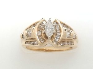Lady's Wedding Set one = 0.25ct Marquise G SI1 Diamond - 14K Yellow Gold
11 = 0.30tw Round Diamonds
26 = 0.45tw Baguette Diamonds