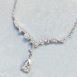 Lady's White 18 Karat Lumiere Bridal Vintage Necklace Length 18/17/16  With 39=0.36Tw Round F Vs2 Diamonds And One 0.50Ct Pear Shape Rose Cut F/G Vs2 Diamond
2.67gr