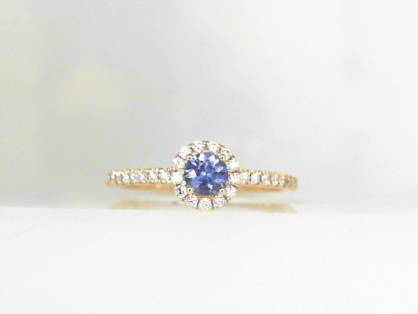 Lady's Yellow 14 Karat Prong Fashion Ring Size 7 With 0.21Tw Round Diamonds And One 0.26Ct Round Blue Sapphire