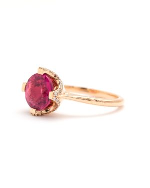 Lady's Rose 18 Karat SHURA Contemporary Fashion Ring Size 7 one = 2.67ct Round Neon Pink  Tourmaline
= 0.67tw Round F/G VS2 Diamonds Gram Weight: 5

Crafted in Barcelona of 18kt Rose gold, simple but, unique , the elegant setting supports and frames anElectric Neon Pink Tourmaline embraced by Sparkling Natural Round Brilliant Cut Diamonds.