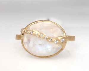 Lady's Yellow 14 Karat Satin Vault Line Fashion Ring Size 6.25 With One = 4.00Ct Oval White Moonstone And 10 = Round Diamonds