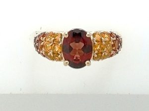 Lady's Yellow 10 Karat Contemporary Fashion Ring Size 7 With One = Oval Garnet