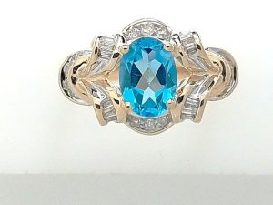 Lady's Yellow 10 Karat Contemporary Fashion Ring Size 6.5 With One = Oval Blue Topaz