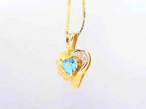 Lady's Yellow 14 Karat Heart Pendants Length 18 With One Heart Blue Topaz And 3= Round Diamonds Style: Herringbone
Metal: 14 Karat
Color: Yellow
Finish: Polished