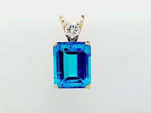Lady's Bracelet one = Emerald Blue Topaz
one = Round Diamond