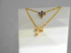 Lady's Yellow 14 Karat Sapphire Cross Necklace With 6=0.24Tw Retangular Cushion Sapphires Chain: Cable Link
Metal: 14 Karat
Color: Yellow