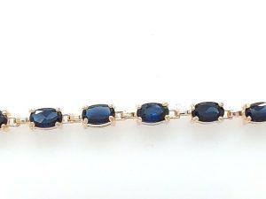 Lady's Yellow 10 Karat Cable Link Bracelet Length 7 With 6 = Oval Blue Sapphires