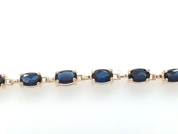 Lady's Yellow 10 Karat Cable Link Bracelet Length 7 With 6 = Oval Blue Sapphires