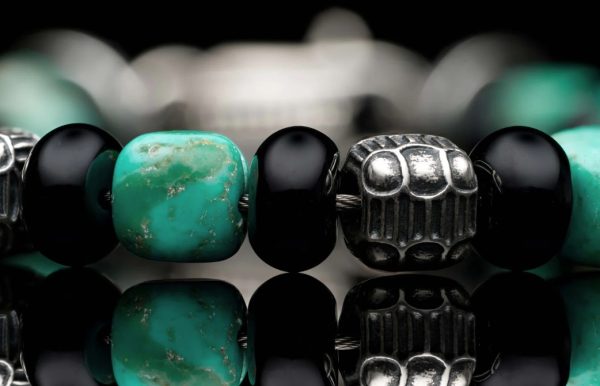 Lady's White Sterling Silver Shadowline Bead Bracelet Bracelet Length 8.5

Featuring Kingman turquoise cube beads, polished black onyx rondelles, and sculpted sterling silver quilted cube beads—finished with a custom clasp.

Bead sizes:
Turquoise cube: 7-8mm
Black Onyx: 8mm

Silver: 6mm - Image 2