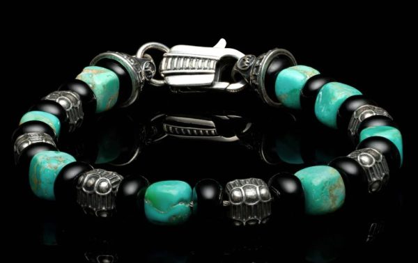 Lady's White Sterling Silver Shadowline Bead Bracelet Bracelet Length 8.5

Featuring Kingman turquoise cube beads, polished black onyx rondelles, and sculpted sterling silver quilted cube beads—finished with a custom clasp.

Bead sizes:
Turquoise cube: 7-8mm
Black Onyx: 8mm

Silver: 6mm - Image 3