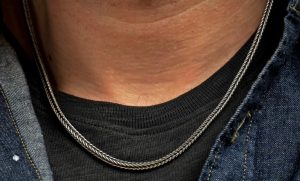 Bold, supple, fluid, snakelike, this foxtail chain in sterling silver is in a league of its own. Beautifully oxidized and hand polished, this complex pattern flows around the neck and draws the eye closer. There are a great many foxtail pattern chains outthere, but precious few that rise to the level of art on their own. Finished with our custom lobster clasp

Sterling Silver Foxtail Chain 22'