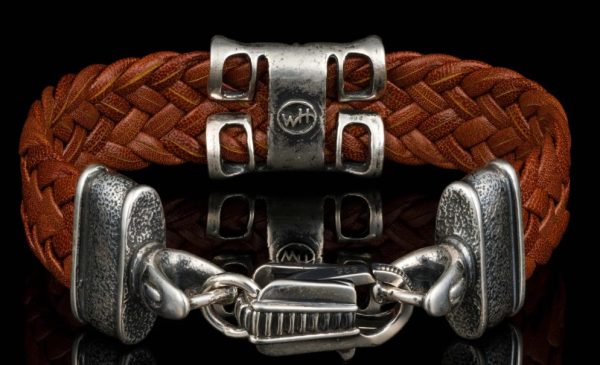 Kangaroo Brown Leather hand crafted with Sterling Silver Accents

Bracelet width 15MM

The ‘Rhomb’ leather bracelet features rich, widely woven kangaroo leather adorned with textured and patinated sterling silver details, offering a depth of appearance that is uniquely William Henry. - Image 2