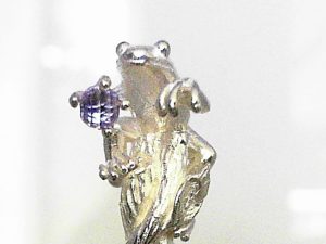 White Sterling Silver Matte/Polished Frog Amethyst Swizel Stick 
Introducing  exclusive collectible swizzle sticks.  These are handmade in solid Sterling Silver (about an ounce in each piece), and set with a faceted Amethyst ball (Amethyst has the mythological property of preventing drunkenness).
They are about 5 inches in length.