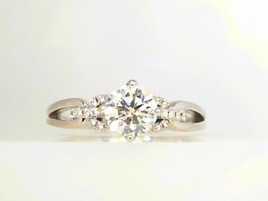 Lady's White 14 Karat Contemporary Engagement Ring Size 6.5 one 0.76ct Round E/F VS2 Diamond
Hearts on Fire Diamond