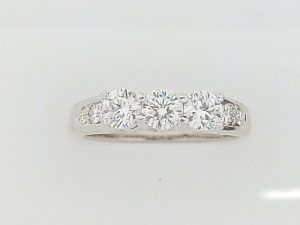 Lady's White 18 Karat 3 Stone Engagement Ring Size 7 one = 0.46ct Round F/G VS2 Diamond
2 = 0.50tw Round F/G VS2 Diamonds
4 = 0.08tw Round F/G VS2 Diamonds