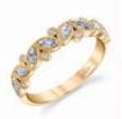 Lady's Yellow 14 Karat Half Anniversary Wedding Band 
Size 6.5 

7 = 0.06tw Round Diamonds
8 = 0.57tw Marquise Diamonds

A cascade of marquise sprinkled with round diamonds. Great for stacking or wear it as your anniversary band!