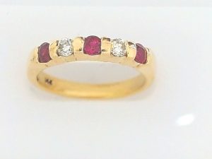 Lady's Yellow 14 Karat Band Fashion Ring Size 7 With 3 = Round Rubys And 2 = Round Diamonds