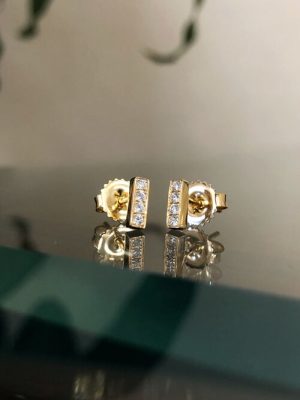 These simply beautiful studs from Kimberly Collins features  6=.10ctw Round G SI1 in 18k Yellow Gold