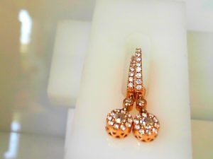 Lady's Rose 14 Karat Huggie Earrings 2=3.00mm Round G/H SI3 Diamonds in center of the dangle
2=1.20mm Round G/H SI3 Diamonds in the Dangle connection
20= Round G/H SI3 Diamonds around the Dangle center stones
18= Round G/H SI3 Diamonds in the huggies