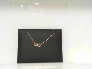 Lady's Yellow 14 Karat Infinity Necklace With 0.04Tw Round Diamonds Style: Cable Link
Metal: 14 Karat
Color: Yellow
Finish: Polished
Length: 18