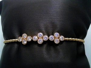 Lady's Yellow 14 Karat Flex Bangle 3 clover station with milgrain Bracelet 12 = 0.95tw Round G/H SI2 Diamonds