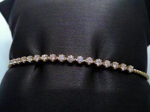 Lady's Yellow 14 Karat Flex Bangle Bracelet 17 = 0.56tw Round G/H SI2 Diamonds