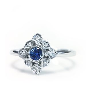 Lady's White 18 KaratParade in Color Vintage Fashion Ring Size 6 With 8=0.03Tw Round F/G Vs2 Diamonds And One 0.13Ct Round Blue Strong Sapphire
SA RD:3.00mm
1.87gr