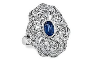 Lady's White 14 Karat Vintage Fashion Ring Size 7 With One 0.60Ct Oval Sapphire And 0.51Tw Round Diamonds