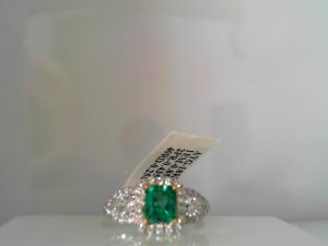 Lady's White 18 Karat Fashion Ring Size 6.5
one 0.86ct Emerald Cut  Emerald
2=0.44tw Pear F/G SI1 Diamonds
40=0.26tw Round F/G SI1 Diamonds