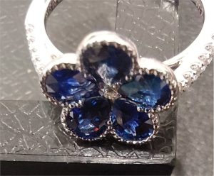 Lady's White 18 Karat Contemporary Fashion Ring Size 6 5=1.88tw Pear Blue Sapphires
13=0.20tw Round Diamonds