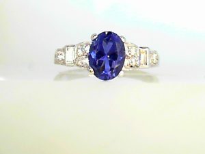 Lady's White Platinum Contemporary Fashion Ring Size 7.25 one 1.40ct Oval Tanzanite
2= Baguette Diamonds
10=2.00mm Round Diamonds