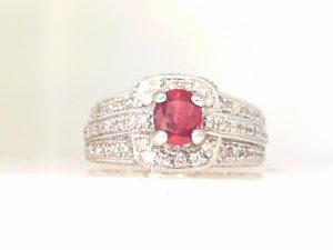 Lady's Fashion Ring one Oval Ruby
1.00tw Round Diamonds