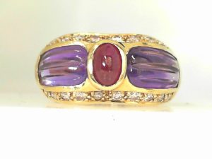 Lady's Yellow 14 Karat Fashion Fashion Ring Size 6.25 10= Round Diamonds
one Oval Ruby
2= Various Shapes Amethysts