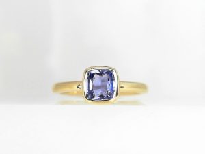 Lady's Yellow 14 Karat Bezel Set Fashion Ring Size 7 With One 1.01Ct Cushion Blue Sapphire