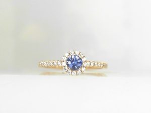 Lady's Yellow 14 Karat Prong Fashion Ring Size 7 With 0.21Tw Round Diamonds And One 0.26Ct Round Blue Sapphire