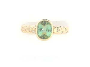 Lady's Yellow 18 Karat NOMAD finish Contemporary Fashion Ring Size 6.5 one = 1.30ct Oval Green Tourmaline
8 = 0.12tw Round F/G VS2 Diamonds Gram Weight: 5.88
Introducing "Stromboli," a captivating ring that draws its inspiration from the grandeur of Sicily's majestic volcano, also bearing the same name. This remarkable piece is a tribute to the volcano's formidable essence, mirroring its resilience and charisma through its exquisite design and captivating tonalities. Crafted to evoke the very spirit of fire and passion that resonates from the island, "Stromboli" stands as a true masterpiece, capturing the essence of this Italian wonder in wearable art.Crafted in Barcelona, Spain