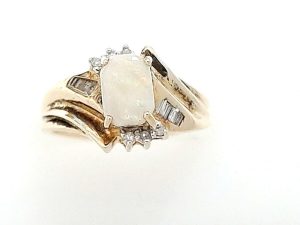 Lady's Yellow 10 Karat Opal Fashion Ring Size 6 With One = Oval Opal And = Round Diamonds