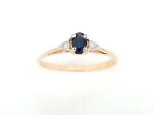 Lady's Yellow 14 Karat Contemporary Fashion Ring Size 6 With One = Oval Sapphire And 2 = Round Diamonds